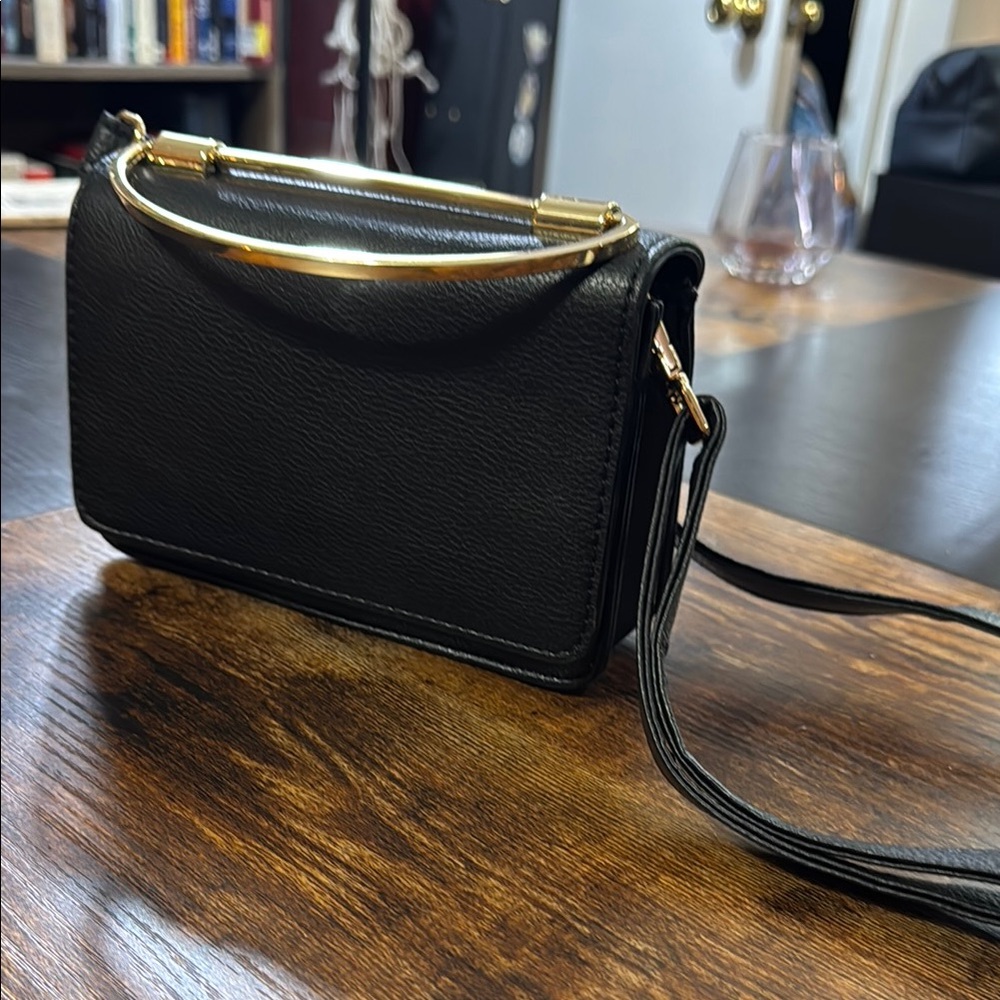 Elegant Black Handbag with Gold Accents